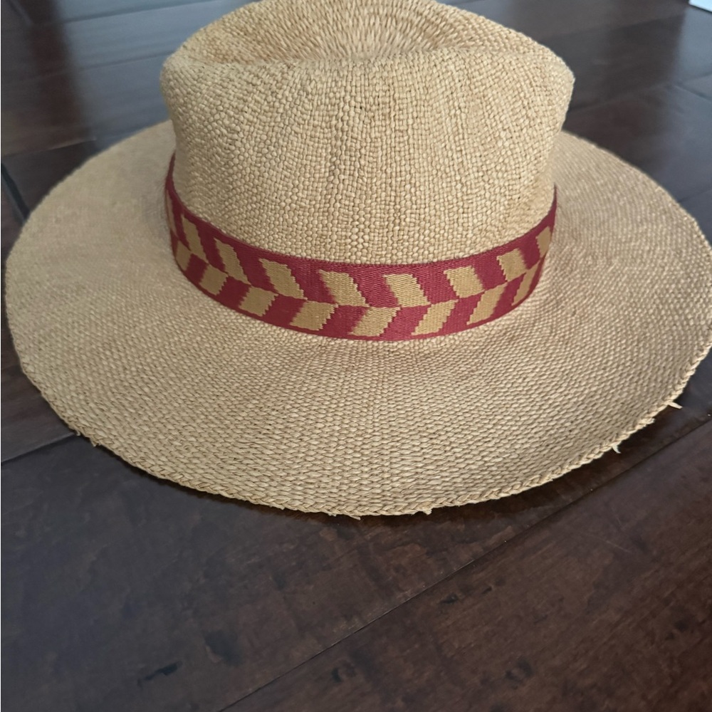 Powder Natasha Hat with a terracotta chevron band.